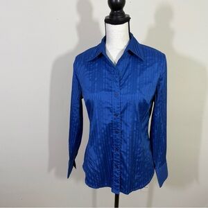 Vibrant blue fabric blouse is quite dressy. Tucks on the front  Button down